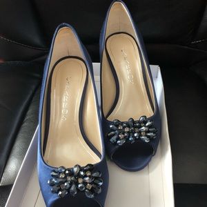 Beautiful blue fancy heels with beaded design on the front.